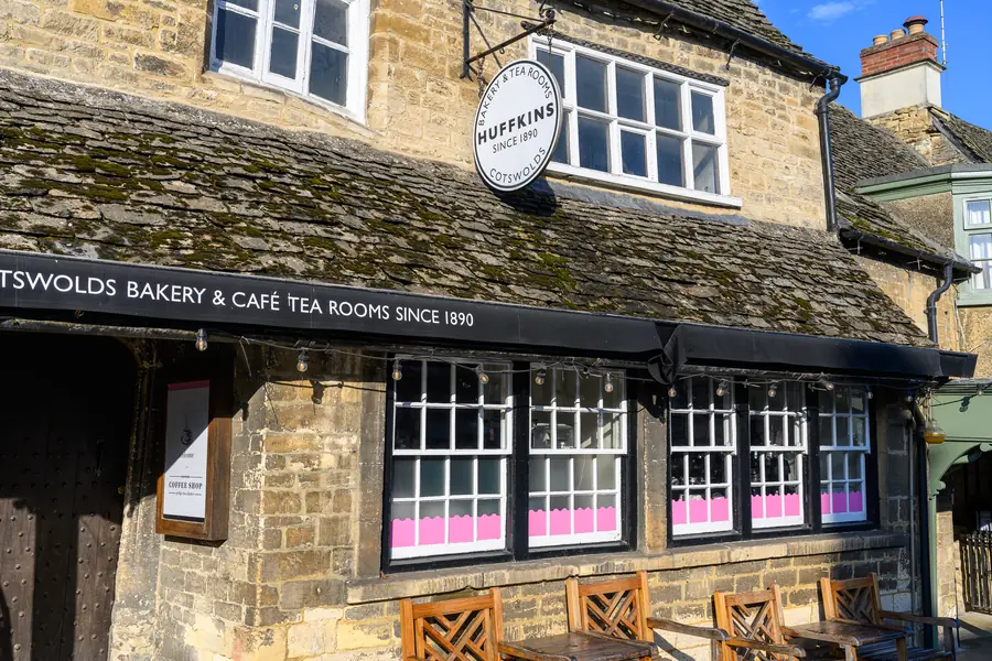 Cotswolds Bakery and Café Tea Rooms on Burford High Street, with the Huffkins sign above the door